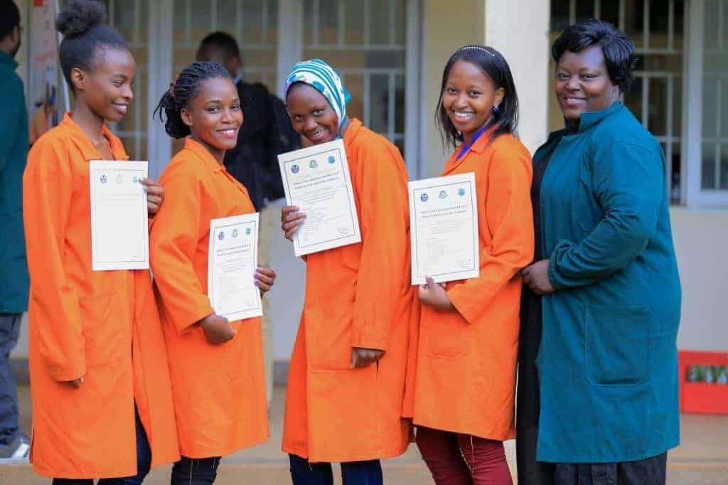 Women holding certificates