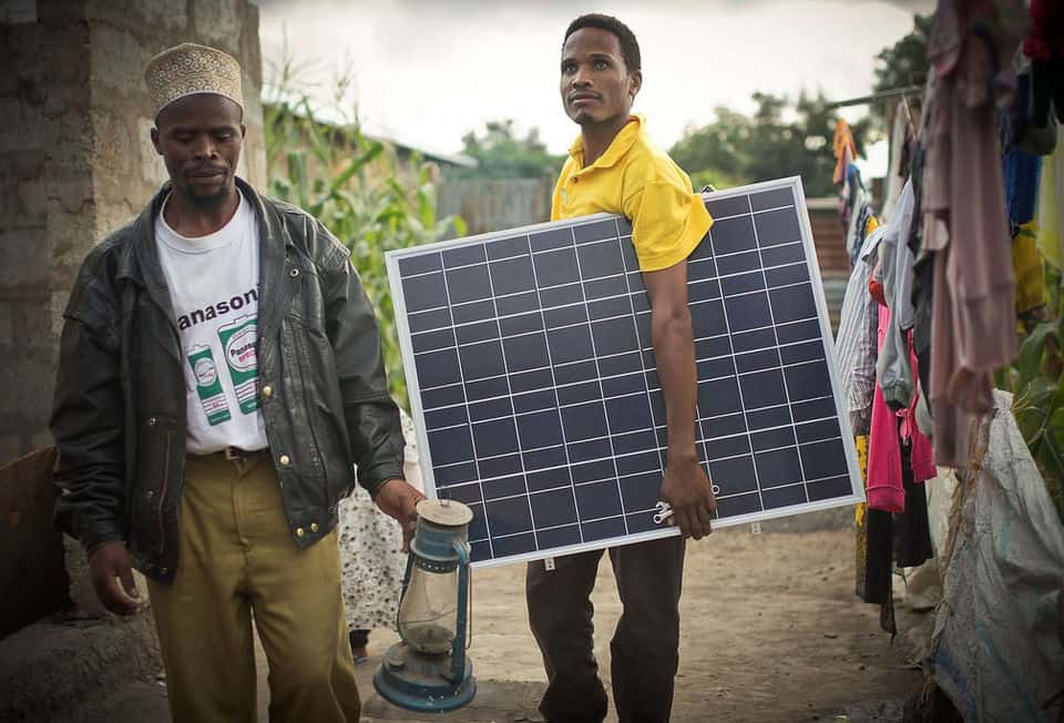 A man holding a solar panel