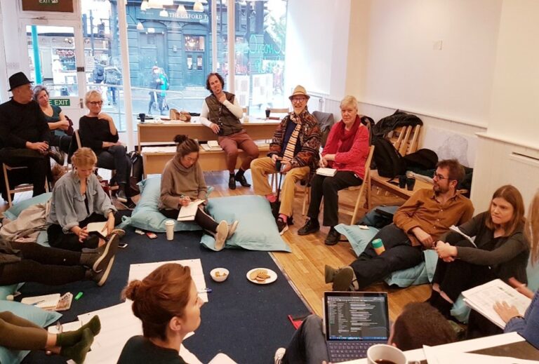 15 people gathered in a collaborative space