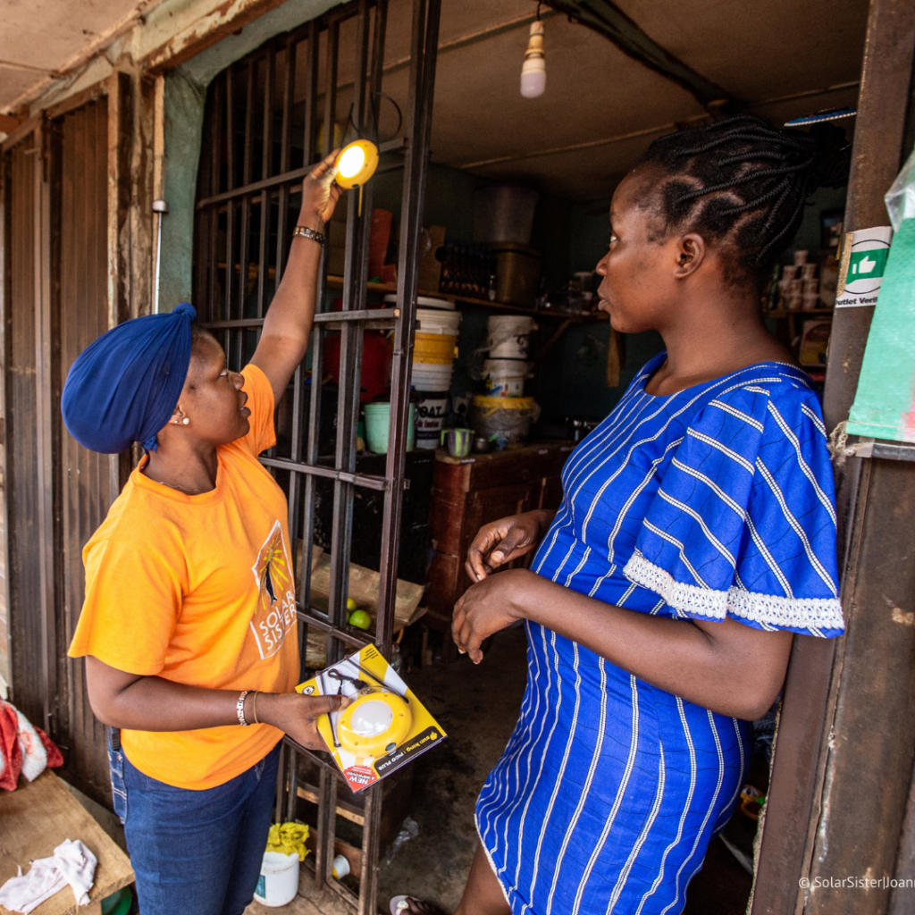 Two women working on a solar light